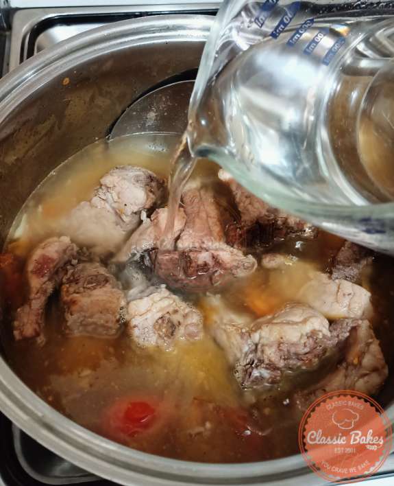 Adding of Pork broth in the pot