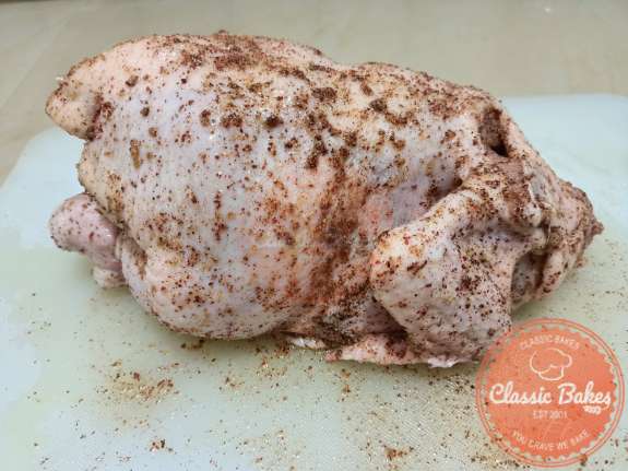 Brush chicken with Olive Oil and rub with the seasoning 