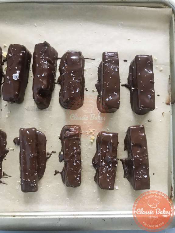 Completed twix bars on a baking tray 