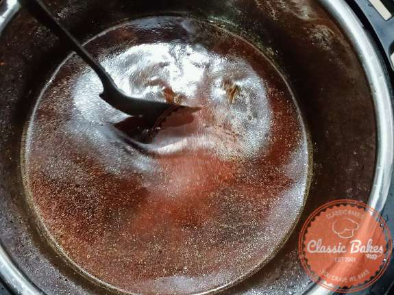 Deglaze the instant pot with Beef Broth using a cooking spoon