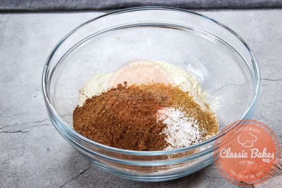Flour, sugar, salt, baking powder and cocoa powder in a large mixing bowl.