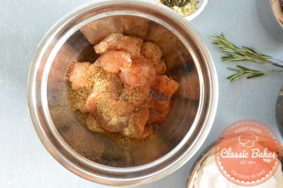 Overview of diced chicken marinating in spices 