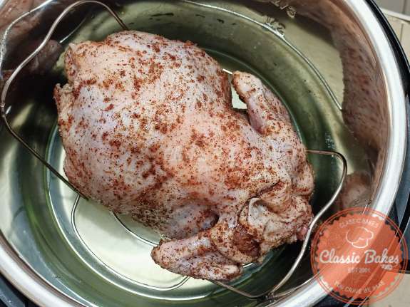 Place chicken inside cooking pot.