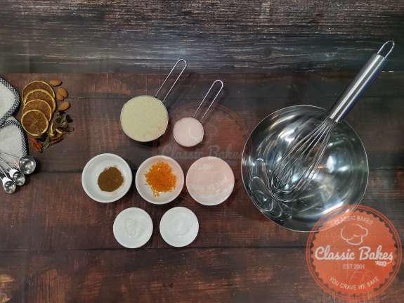 Overview of dry waffle ingredients being combined in a mixing bowl. .