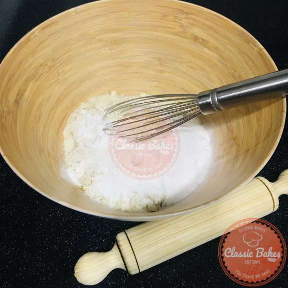 Dry ingredient being whisked in a bowl 