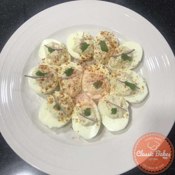A plate filled with horseradish deviled eggs 