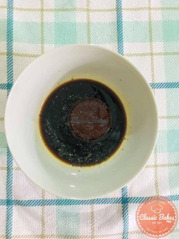 Overview of balsamic dressing in a small bowl 