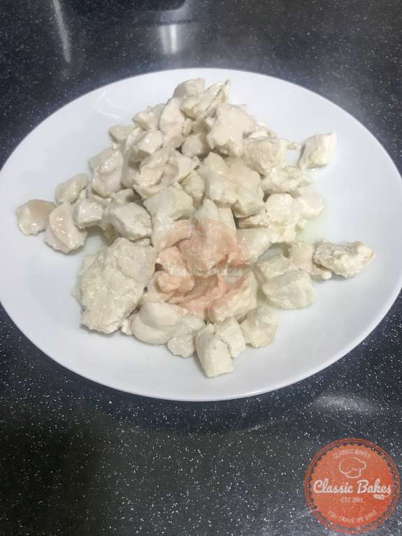 Seared diced chicken on a plate
