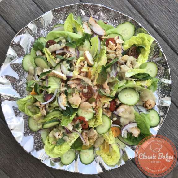 Overview of a platter of shawarma chicken salad on a tabletop 