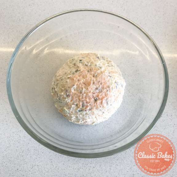 Overview of keto cheese ball ingredients in a bowl shaped into a ball