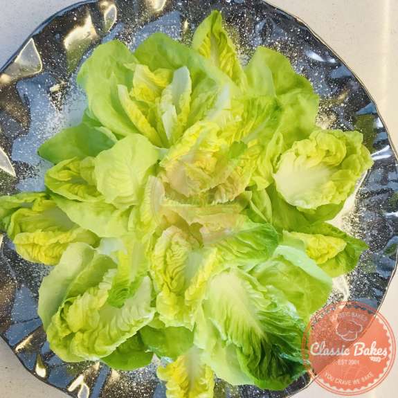 Overview of a platter of butter and romaine lettuce 
