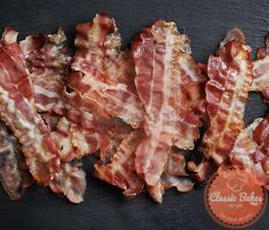After flipping the bacon halfway through cooking, bake the bacon for 10 to 12 minutes, or until it is crispy.