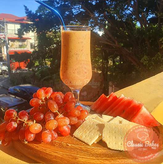 Grape Smoothie with fruits and crackers-afternoon snack