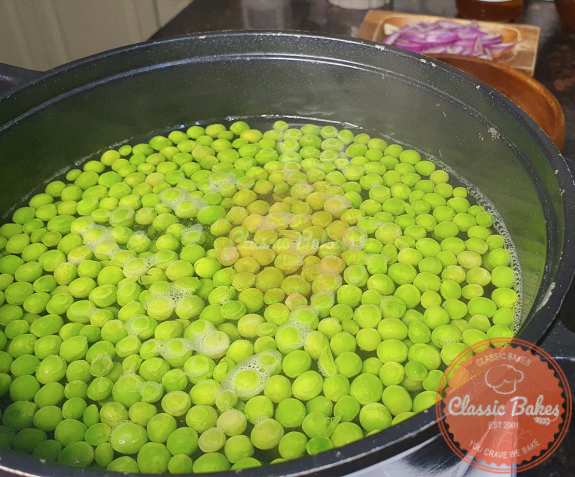 The peas should be added to the stew and cooked for 2 minutes.
