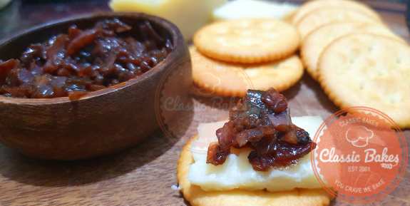 Onion Chutney on top of a cracker with white cheddar close up