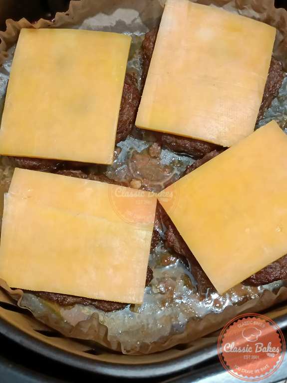 Adding cheese to the Air Fryer Hamburgers