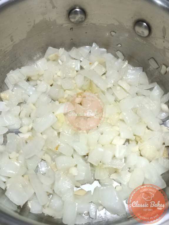 Sautéed onion with ginger and garlic in a pot
