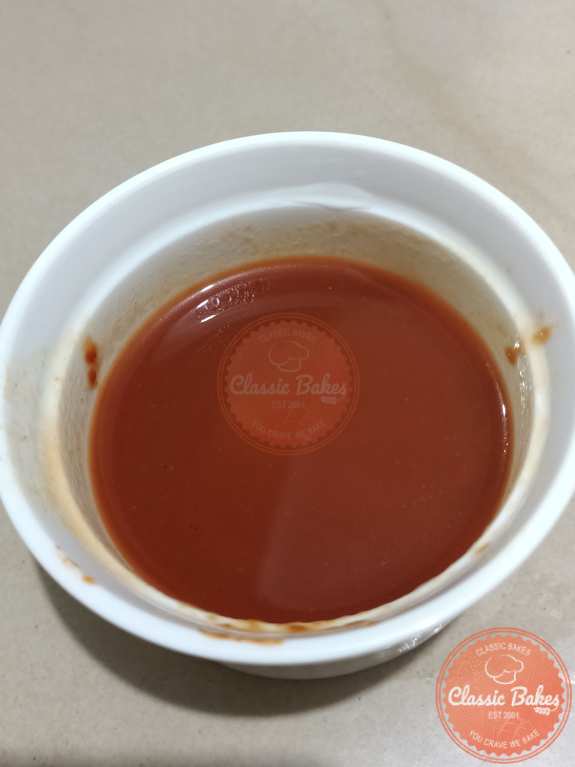 Tomato paste with water in a bowl