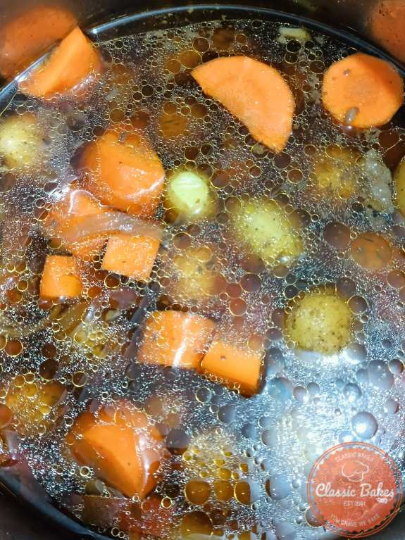 Cooking the carrots and baby potatoes