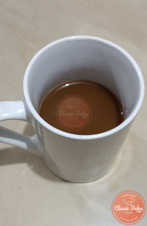 Prepare espresso into coffee mug