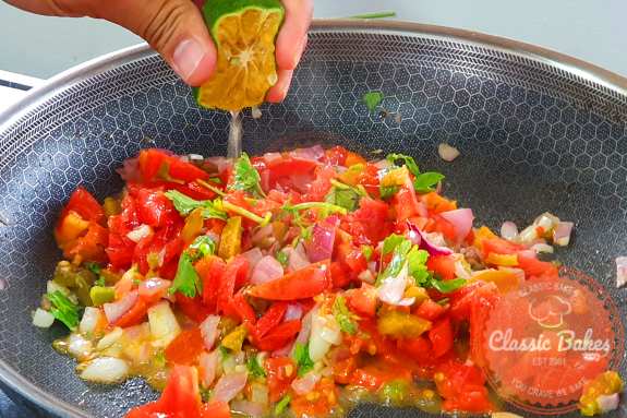Stir in the cilantro, maple syrup, lime juice, cumin, kosher salt, and Roma tomatoes after adding them.
