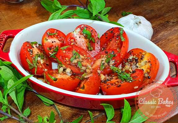  Place the prepared tomatoes in a ramekin or baking dish.