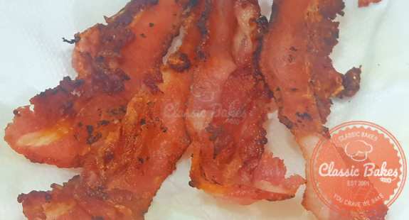 Put the fried bacon slices on a paper towel.