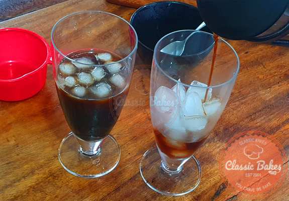 Split the ice evenly into two glasses and then pour the coffee over the ice. Use a spoon to mix it, and serve immediately.