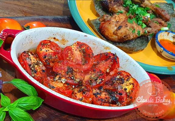  Take the tomatoes off the grill and transfer them to a serving plate. Now, you can enjoy this simple and delicious side dish.