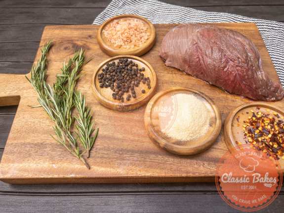 Put the sirloin tip roast on a cutting board and use a sharp knife to remove any excess fat from the meat.