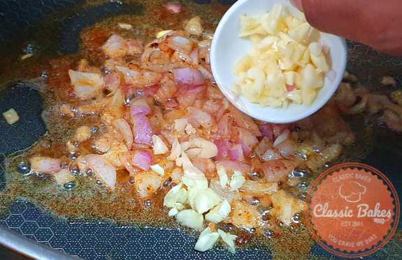 Following that, introduce garlic and shallots into the skillet where you cooked the chicken. Cook them for about 1 minute or until they become fragrant.
