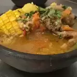 Front shot of Trinidad Corn Soup in pot clay bowl