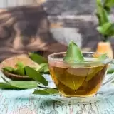 Cup of Bay Leaf Tea with leaves on the side