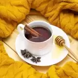 Cinnamon Tea surrounded by yellow cloth