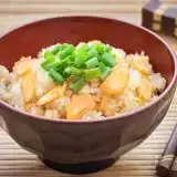 Garlic fried rice in a bowl with chopsticks on side