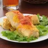 Front shot of Beef Chimichangas in a plate with lettuce