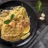 Aerial view of Lemon Chicken Pasta with knife on the side