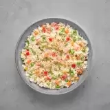 Aerial shot of Vegetable Fried Rice in a bowl in gray background