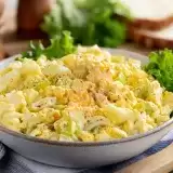 Front shot of Keto Egg Salad in a bowl with lettuce on the side