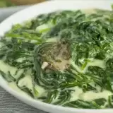 Close up shot of Vegan Creamed Spinach in a bowl