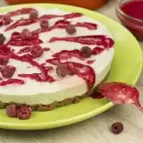 Front shot of Vegan Raspberry Cheesecake in a plate with spoon on the side