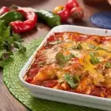 Front side shot of Low Carb Keto Chicken Enchiladas  in a baking dish