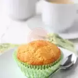 Front shot of Vegan Cornbread Muffins in a plate with small fork
