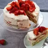 Vegan Strawberry Cake slice next to entire cake