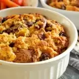 Sideview of bread pudding in a large ramekin 
