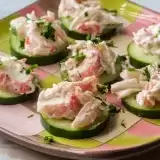 Sideview of crab salad sushi on a cucumber  