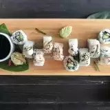 Top View of Veggie Sushi Rolls on a wooden cutting board