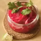 Close up shot of Pickled Red Onions Mexican in a glass