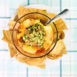 Overview of chili dip in a bowl with a spoon inside 
