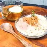 Front shot of Sugar Free Rice Pudding in a bowl with tea on the side